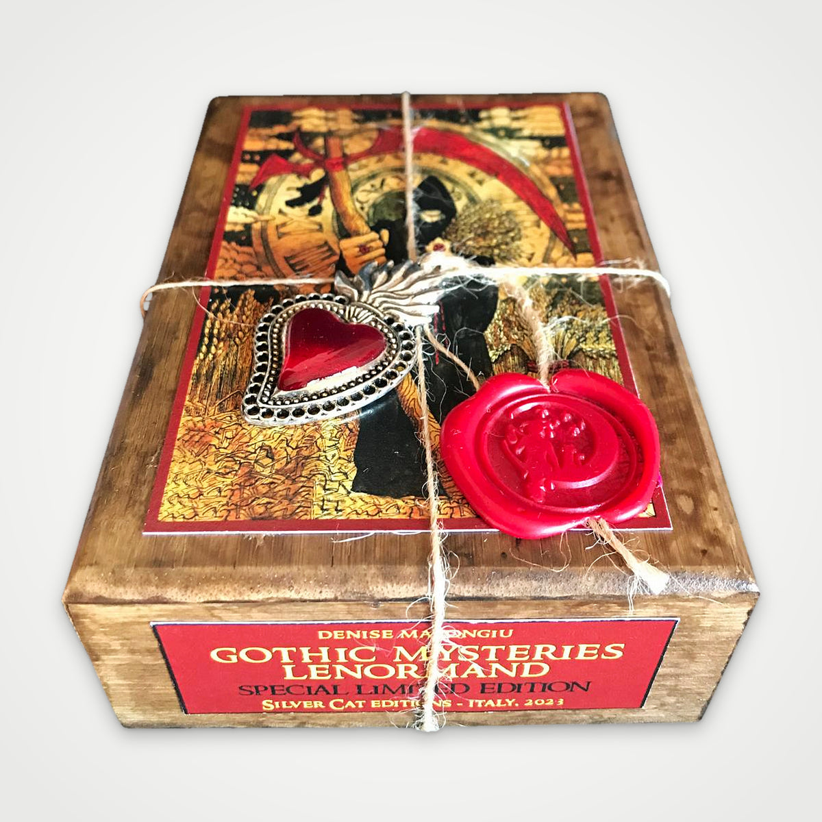 Brown wooden box, three-quarter view with the red edition label, twine and wax seal