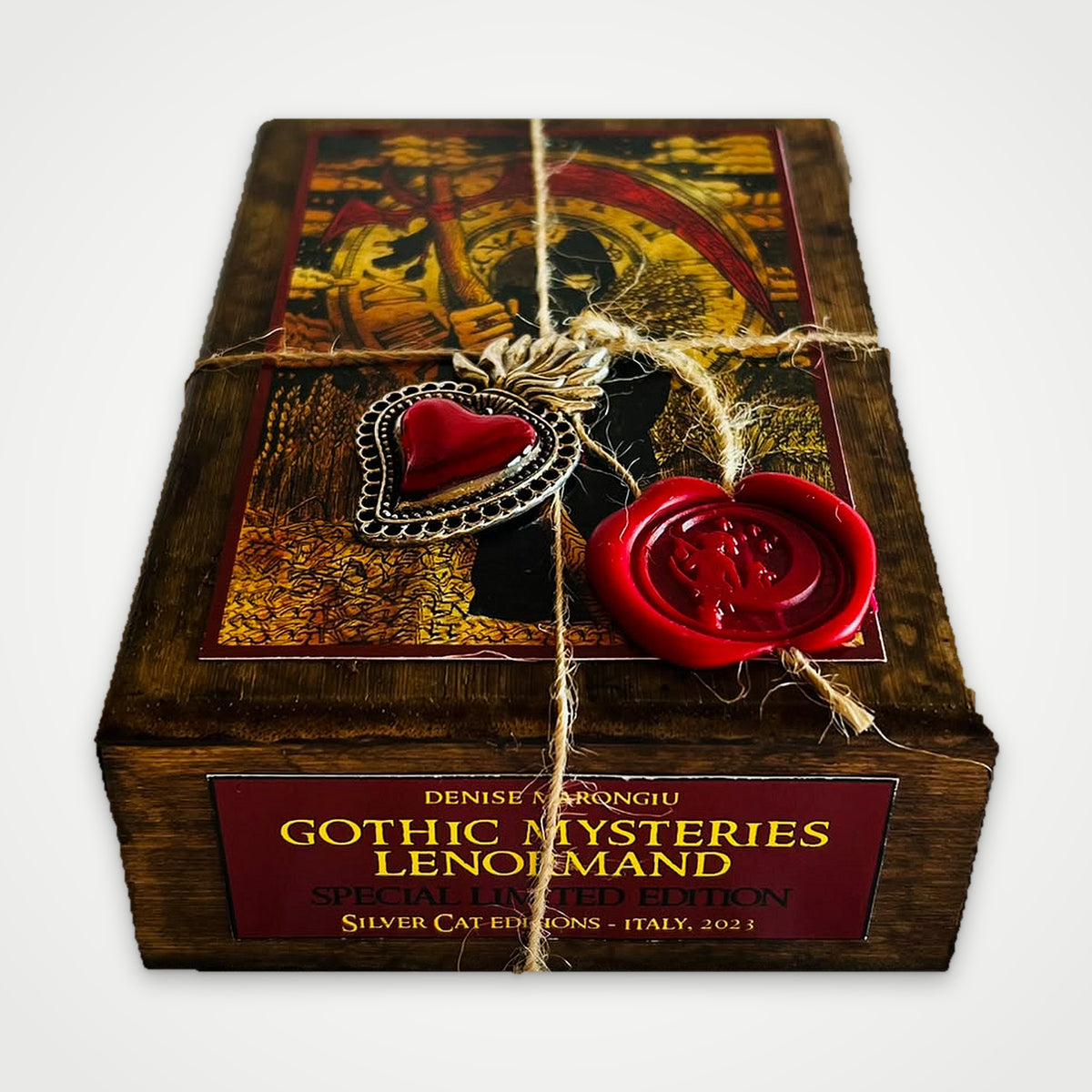 Front of the brown wooden box with the Gothic Mysteries Lenormand Special Limited Edition label by Silver Cat Editions