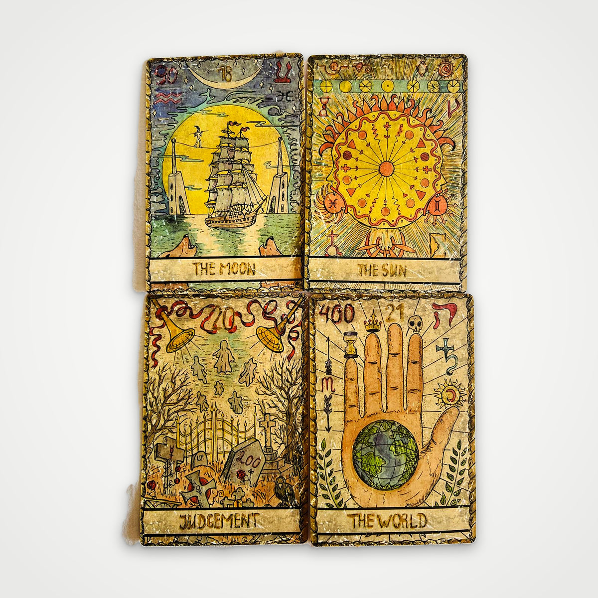 Samiramay Tarot Major Arcana cards: The Moon, The Sun, Judgement and The World
